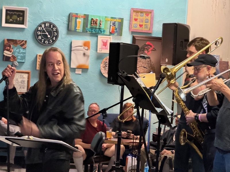 The horn section mid-song: trombone, saxophone and trumpet